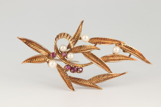 A 9ct yellow gold floral spray brooch set with rubies and seed pearls, 60mm, 5 grams 