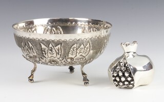 An 830 standard repousse bowl on scroll feet together with a silver pomegranate, gross weight 212 grams