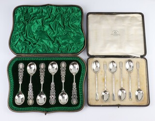 A set of 6 Victorian silver teaspoons with pierced handles London 1898, contained in a shaped fitted case together with 6 silver coffee spoons with fancy stems Sheffield 1919 cased, 138 grams 