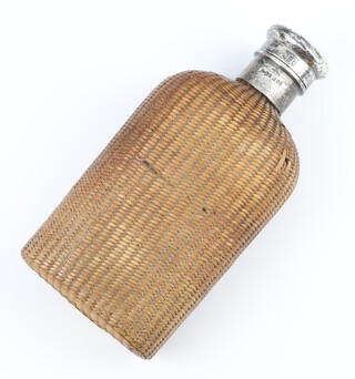 A Victorian silver mounted spirit flask Birmingham 1897, wicker covered, 18cm 