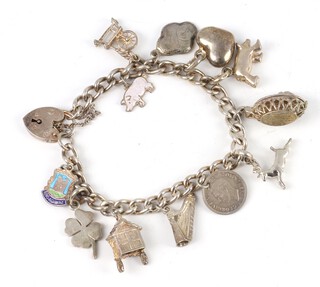 A silver charm bracelet 44 grams