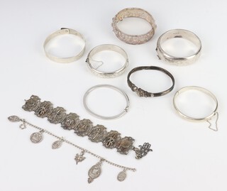 A silver bangle and a quantity of silver bracelets and bangles 200 grams 