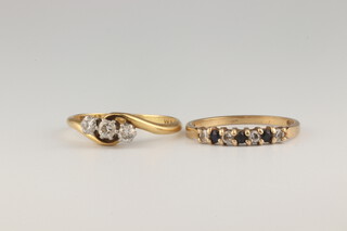 A 9ct yellow gold 3 stone diamond ring, a sapphire and diamond ditto, both size L 3.1 grams