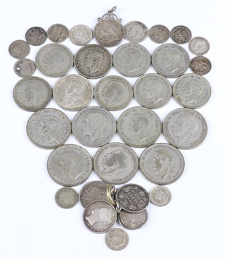 A quantity of pre-1947 coinage including half crowns, 2 shillings and sixpences, 248 grams 