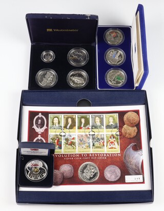 The Duke of Wellington 150th Anniversary Channel Islands 3 coin silver set, a Guernsey 1997 silver proof Castles of The British Isles 4 coin set, a Westminster Royal British Legion 90th Anniversary silver poppy five pound coin and a 2010 Revolution to Restoration Commemorative coin, 234 grams 