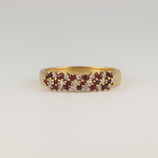 An 18ct yellow gold ruby and diamond ring, size N 1/2, 3.6 grams 