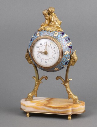 A 19th Century timepiece with enamelled dial, Arabic numerals, contained in a champleve enamelled case surmounted by cherubs 20cm x 14cm x 6cm 