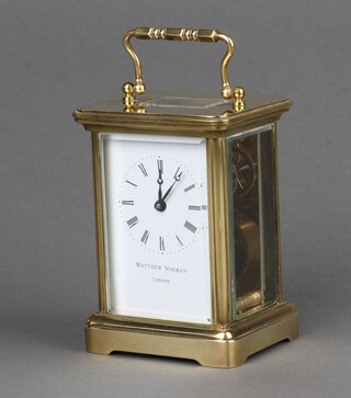 Mathew Norman, a 20th Century carriage clock with enamelled dial, Roman numerals, contained in a gilt metal case 11cm h x 8cm w x 7cm d, complete with key 