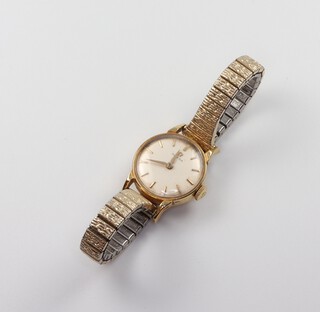 A lady's 18ct yellow gold Omega wristwatch, the 20mm case numbered 2983, the movement numbered 17289283