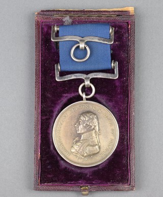 A white metal Boulton's Trafalgar medal with white metal suspension bars 