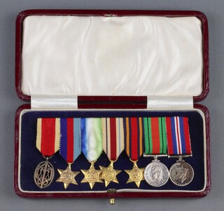 A group of 7 miniature medals comprising Knight Bachelor's badge, 39-45 Star, Atlantic Star, Africa Star, Burma Star, Defence and War medal, cased