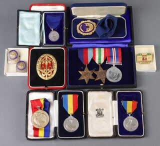 The medals and awards of Colonel Sir William Thomson Halcrow Kt. MICE 1883-1958 comprising Knights Bachelors Badge cased, 1939-45 Star, Italy Star, British War medal mounted for wear, a Worshipful Company of Musicians medal, cased, a gilt metal and enamel Past Overseers jewel for the Society of St Margaret and St John Westminster, the reverse named Sir William Halcrow, cased, a silver Worshipful Company of Musicians medal named to L J H Halcrow JP, cased, 2 other Worshipful Company of Musicians medals and 3 enamelled badges, together with a Who's Who entry and paperwork 