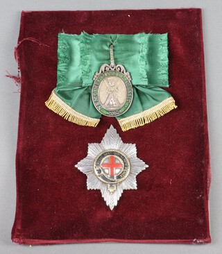 A facsimile Star of The Most Noble Order of The Garter, together with a facsimile sash badge of The Most Ancient Order of The Thistle, framed 