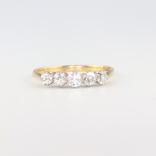 An 18ct yellow gold 5 stone diamond ring, approx 0.7ct, size Q, 2.1 grams 