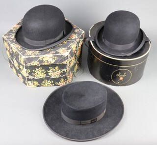 A Dunns bowler hat, size 6 7/8 and hat box, a Harrods bowl hat size 7 1/2 complete with box and a Fedora hat, size 6 7/8