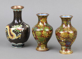 A pair of green and floral patterned cloisonne enamelled club shaped vases 12cm together with a black ditto decorated a dragon 16cm 