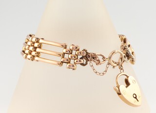 A 9ct yellow gold bracelet with heart shaped padlock, 15.6 grams, 18cm 