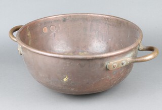 A 19th Century twin handled circular copper bowl  with rounded base 20cm h x 43cm diam. 