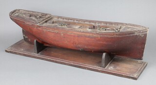 A 19th Century wooden model of a boat with solid oak hull 21cm h x 92cm w x 21cm d 