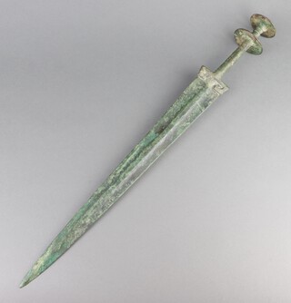 An ancient bronze Luristan sword with 49cm double blade and disc pommel 