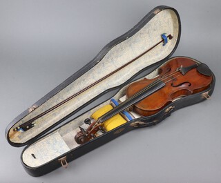 A violin with 2 piece back, the 14" back stamped a 4 above a cross with a circle containing the letters AS 