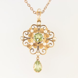 An Edwardian yellow gold 15ct seed pearl and peridot pendant on a gilt chain and a 9ct bracelet 16cm, gross weight 5.3 grams 