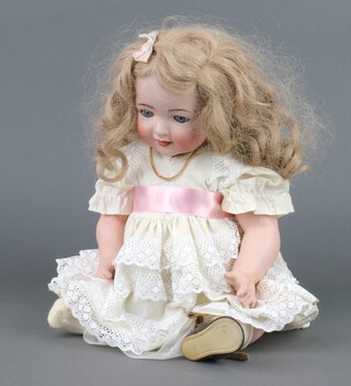 Kammer and Reinhardt,  a bisque headed doll with open mouth, weighted eyes, articulated bisque limbs, head numbered mould 22, dressed in a lace dress with brown hair