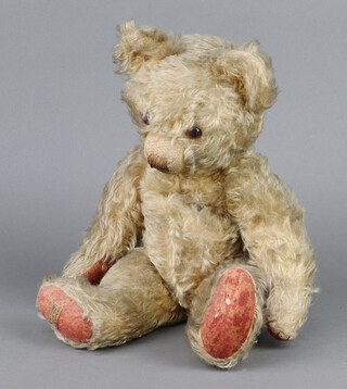 A Merrythought wood wool filled mohair teddy bear with brown and black button eyes and stitched snout, stitched pads and label, with growl box (not working) 46cm 