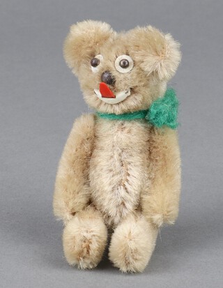 A post-war miniature Schuco style mohair teddy bear with double revolving head 9cm 