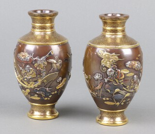 A good pair of Meiji period Japanese bronze vases with gilt, silver and copper decoration depicting figures in boats amongst lilies and flowers 14cm 