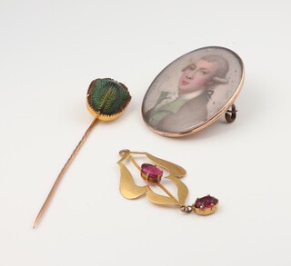 A yellow gold testing as 9ct, scarab beetle tie pin, a ditto garnet set pendant and an oval 19th Century portrait miniature brooch 