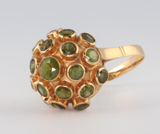 A yellow gold testing as 14ct peridot set ring, 4.3 grams, size N 