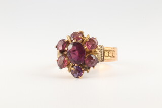 A yellow gold marked 14k amethyst cluster ring, 3.8 grams, size O 1/2