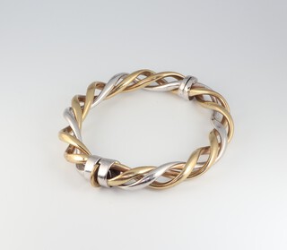 A 9ct two colour gold twist bangle, 24.9 grams 