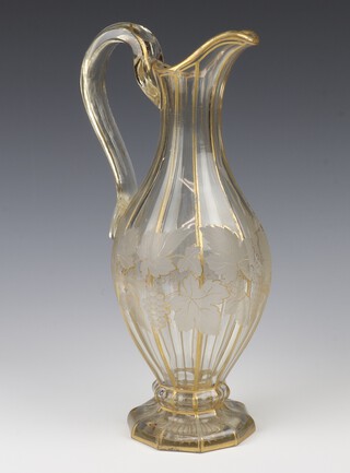 A 19th Century Continental faceted glass ewer with gilt scrolling vineous decoration 33cm 