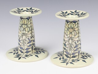 A pair of Dennis Chinaworks tapered candlesticks by Sally Tuffin numbered 1 and 2, dated 2006, 15cm 