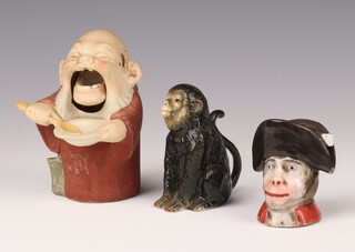 A 19th Century German bisque novelty figure of a man with articulated jaw eating from a bowl of food 11cm, a Continental figure of a seated chimpanzee 8cm and a porcelain ink stand of a monkey wearing a hat 6cm 