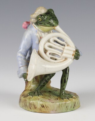 A 19th Century Continental porcelain figure of a bewigged frog playing a French horn 11cm 