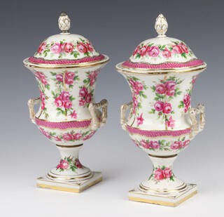 A pair of 18th Century style porcelain twin handled vase and covers decorated with roses on square bases 25cm 