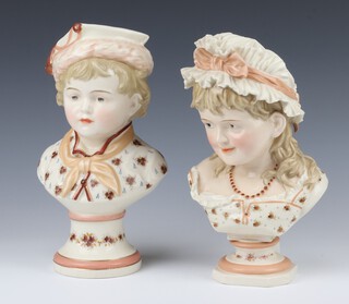 A near pair of 20th Century KPM busts of a boy and girl 25cm 