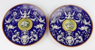 A pair of late 19th Century Italian Majolica plates decorated with mythical beasts signed Jinori 138/621 24cm 