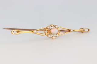 An Edwardian yellow gold testing as 15ct opal and seed pearl bar brooch, 60mm,  2.8 grams 