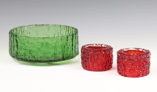 A pair of Whitefriars ruby red glass "Bark" candleholders 6cm, pattern no: 9783 together with a Whitefriars meadow green "Bark" circular bowl 10cm 