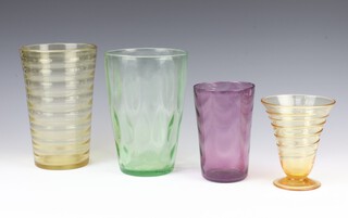 A Whitefriars aubergine purple tumbler vase with waved ribbed pattern, pattern no: 8473, 15cm and an amber ribbon trail ditto,  pattern no" 9296, 13.5cm, a Whitefriars smoky glass cylindrical vase 21cm, a green ditto 20cm