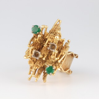 A yellow gold, testing as 18ct, abstract mid-Century dress ring, set with 2 emeralds (ex 4), size K, 13.6 grams 