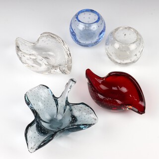 A Whitefriars ruby red glass ashtray 15cm, pattern no: 9558,  a clear glass ditto 14cm, a  globular sapphire blue vase 8cm, pattern no: 9377, a clear glass ditto 9cm and a Whitefriars blue glass dish in the form of a leaf 15cm, all with controlled bubbles