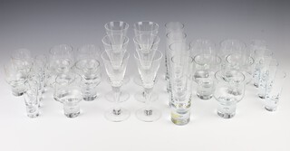 R A Hickman for Kosta, a suite of Kosta Boda Pippi drinking glasses,  comprising 6 flutes 17cm, 4 high ball tumblers 19cm, 6 tots 9cm, 10 wine glasses 11cm, 2 small wines 10cm and 4 large tots 12cm 