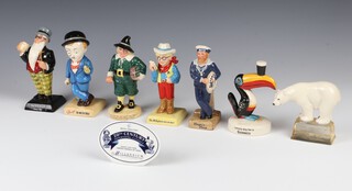 Seven Royal Doulton 20th Century Advertising Classics - John Ginger AC6 1075/2000 15cm, The Milky Bar Kid AC7 1651/2000 14cm, Players Hero AC5 1285/2000 14cm, Foxes Polar Bear AC4 1309/2000 10cm, Father William AC2 1471/2000 15cm, Sir Kreemy Knut AC3 1484/2000 16cm, Guinness Toucan Lovely Day for a Guinness AC8 no.1233/2000 12cm and a table top plaque 8cm 