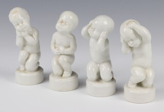 Four Bing & Grondahl figures of white glazed babies on round bases 2206, 2207, 2208 and 2209 11cm 