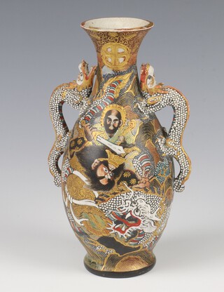 A 1920's Japanese Satsuma vase with dragon handles decorated with warriors with seal mark to base 18cm 